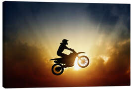 Obraz na płótnie  Biker jumping at sunset